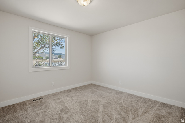 337 North Main Street Central Valley, UT 84754 - Photo 23 of 40 Spare room featuring light carpet and baseboards