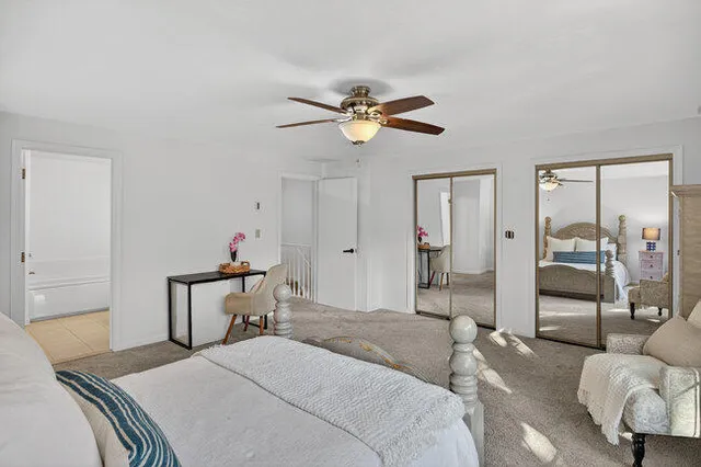 a bedroom with a bed and furniture