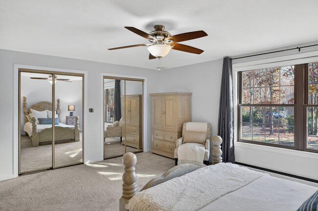 195 Falmouth Road, Unit 10E Mashpee, MA 02649 - Photo 29 of 33 a living room with furniture and two window