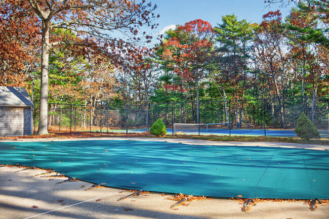 195 Falmouth Road, Unit 10E Mashpee, MA 02649 - Photo 33 of 33 a view of a swimming pool with a yard