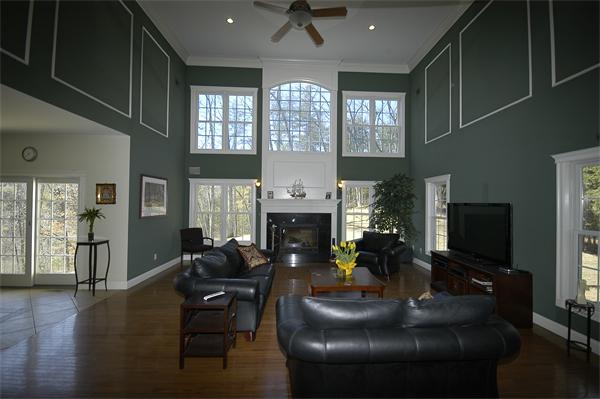213 Wheelwright Road Barre, MA 01005 - Photo 16 of 29 a living room with furniture a fireplace and a flat screen tv
