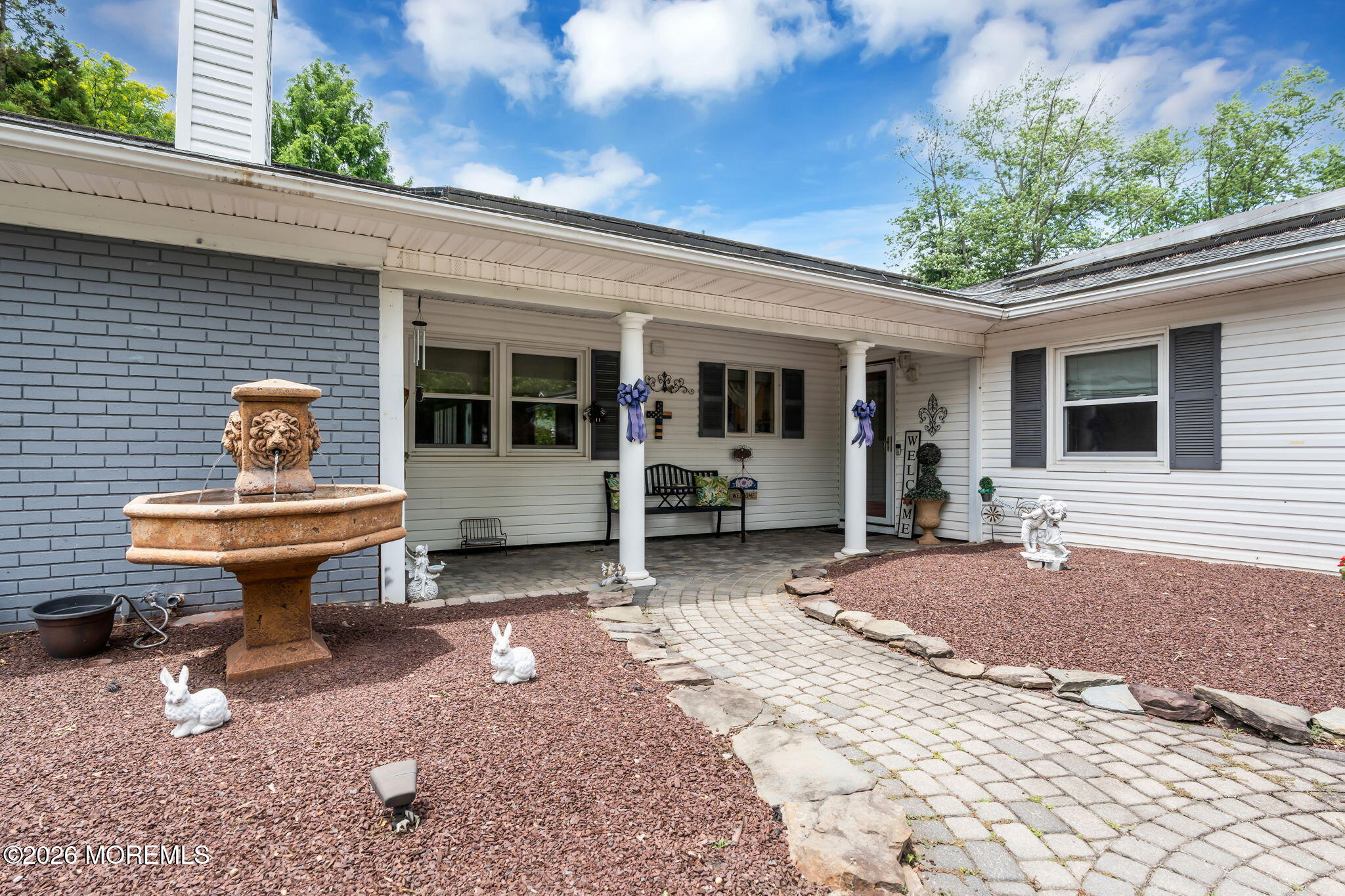 8 Owens Road Marlboro, NJ 07746 - Photo 4 of 39 a backyard of a house with outdoor seating