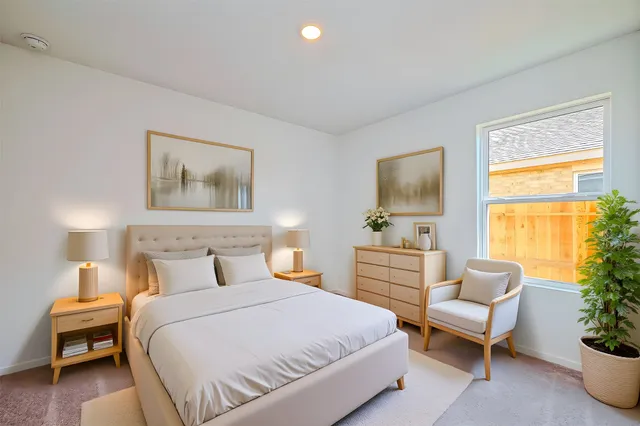 a bedroom with a bed and a couch