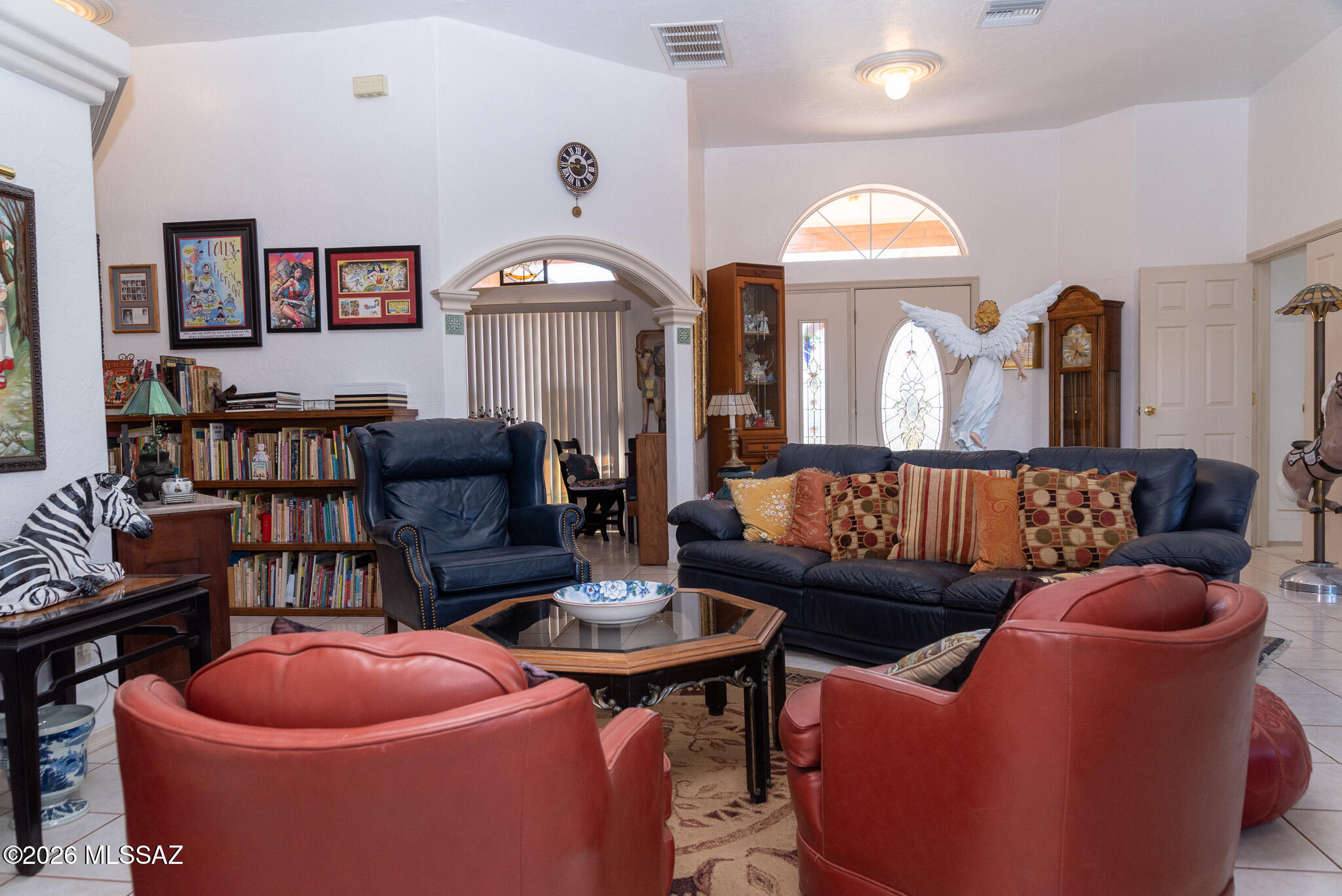 1242 Vista Court Rio Rico, AZ 85648 - Photo 2 of 16 a living room with furniture a rug and a large window
