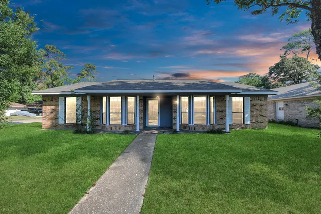 a view of a house with a big yard