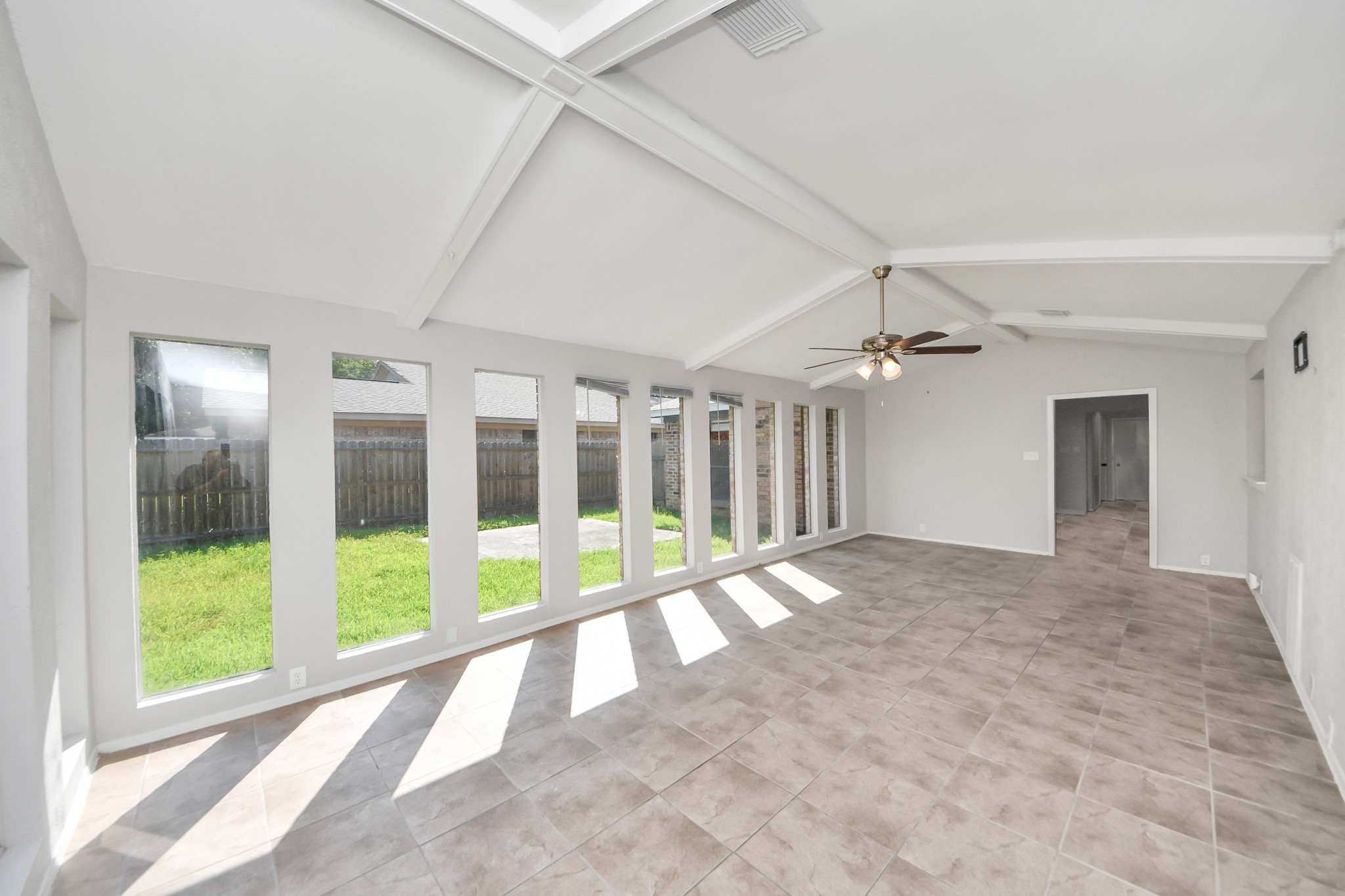 7303 Foxwick Lane Humble, TX 77338 - Photo 14 of 38 a view of an empty room with a sliding door