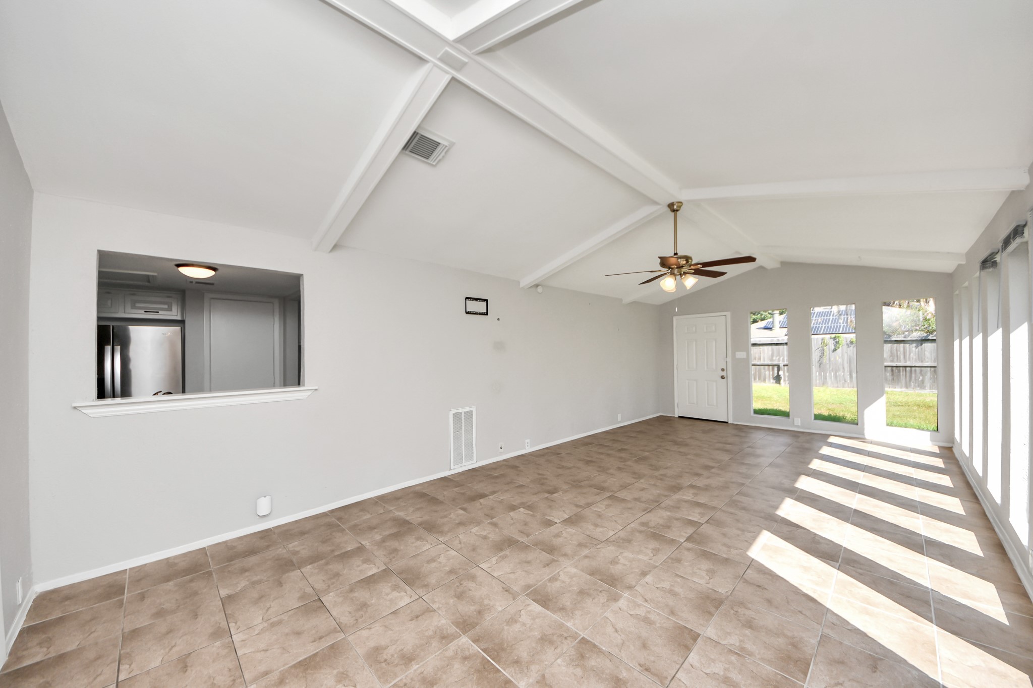 7303 Foxwick Lane Humble, TX 77338 - Photo 15 of 38 wooden floor in an empty room with a window
