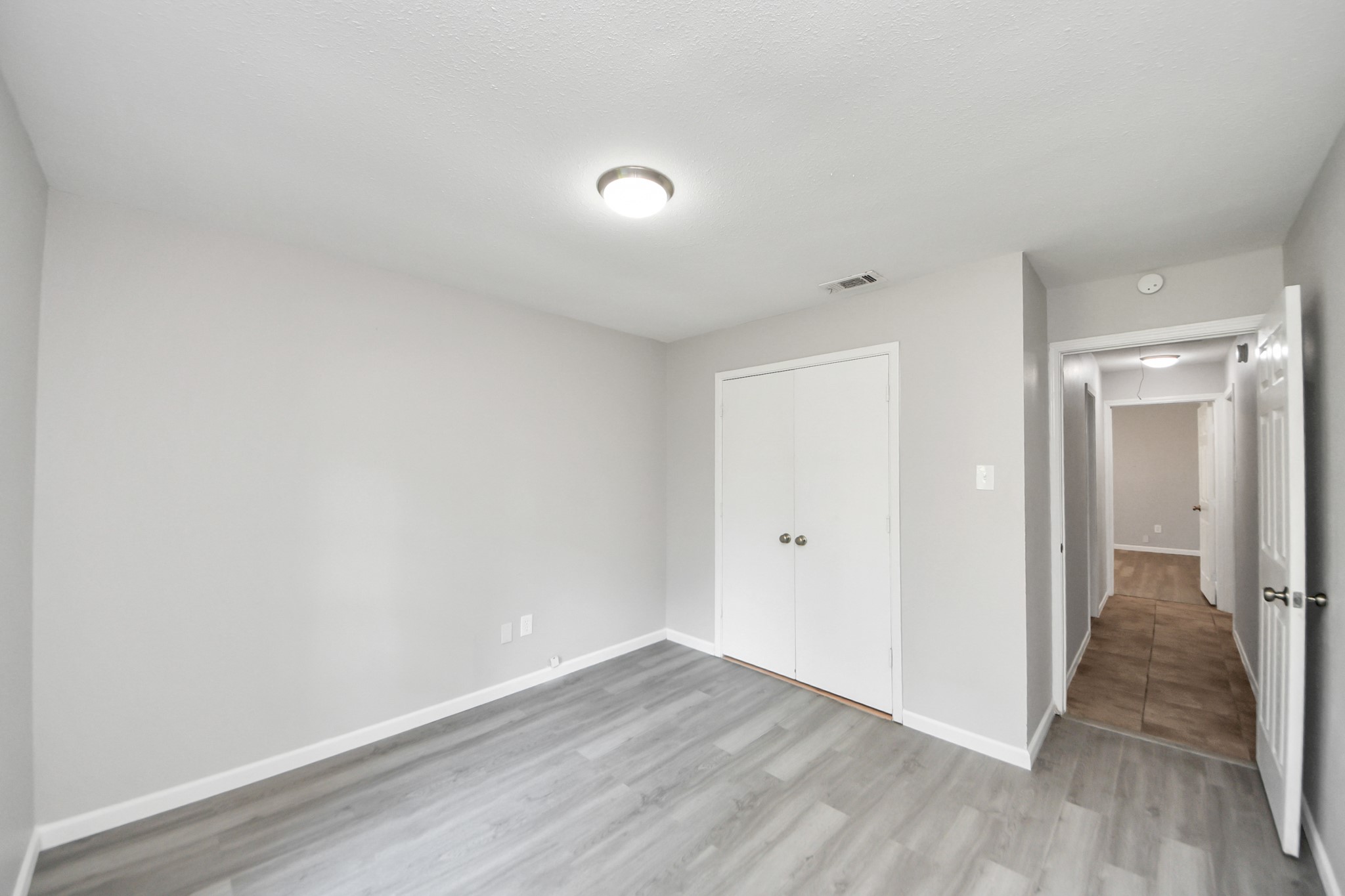 7303 Foxwick Lane Humble, TX 77338 - Photo 16 of 38 a view of a room with wooden floor
