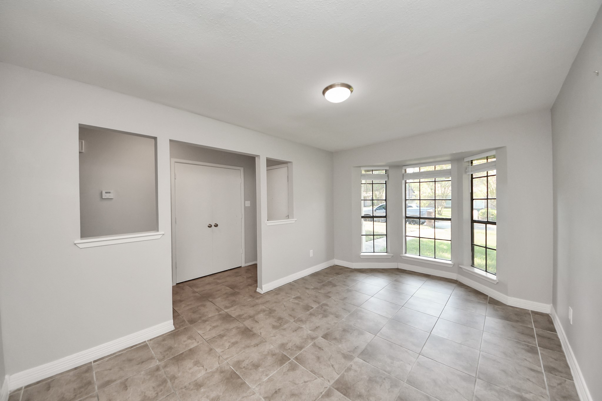 7303 Foxwick Lane Humble, TX 77338 - Photo 9 of 38 a view of an empty room with a window