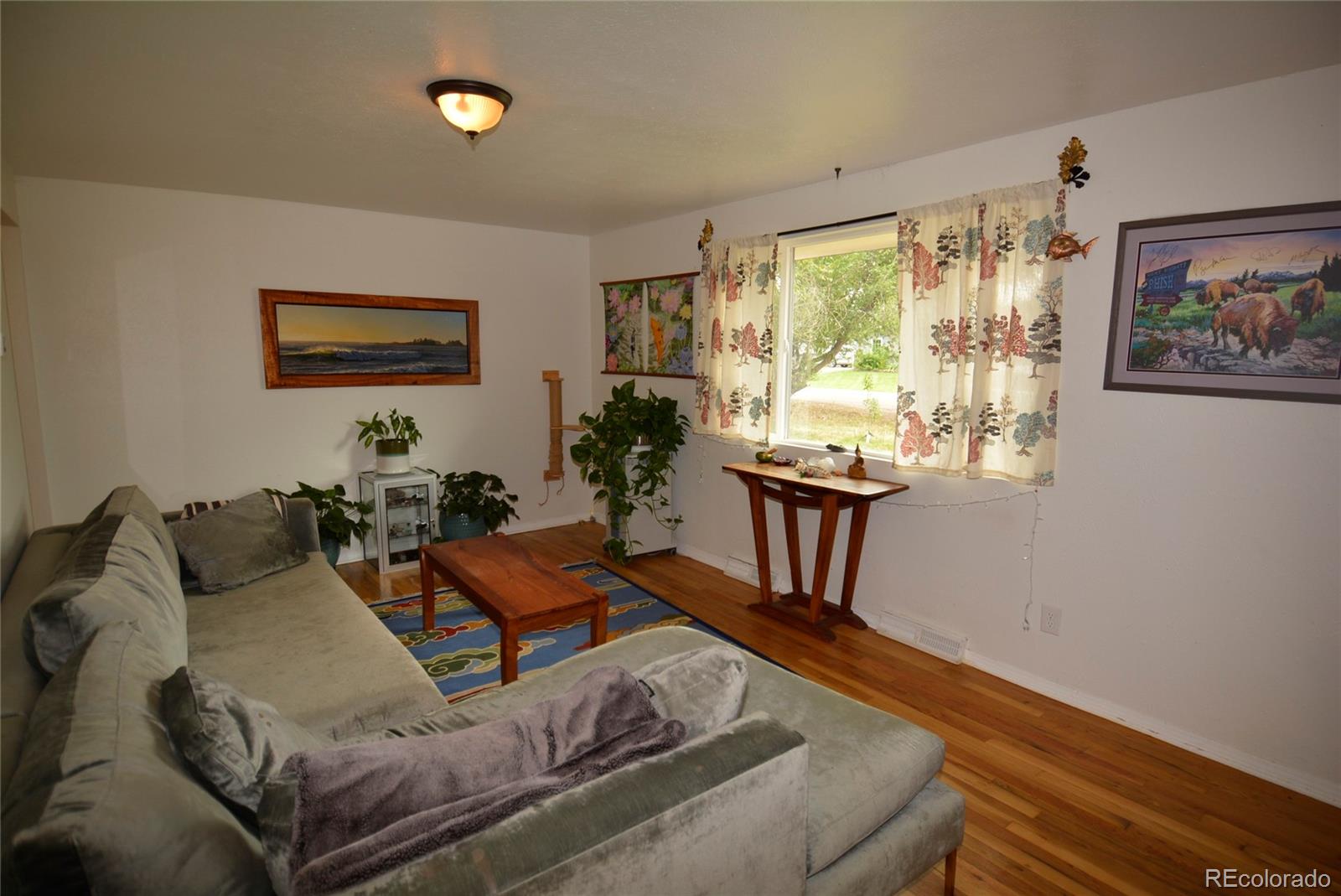 4975 Howell Street Golden, CO 80403 - Photo 13 of 23 a living room with furniture and a large window