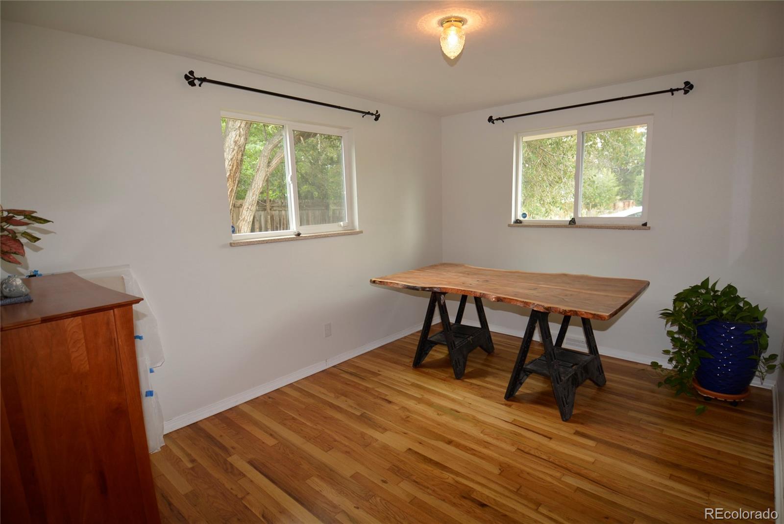 4975 Howell Street Golden, CO 80403 - Photo 15 of 23 a workspace with wooden floor