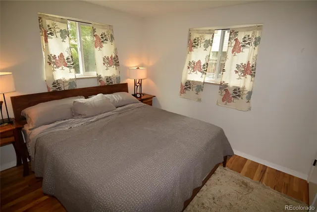 a bedroom with bed and window