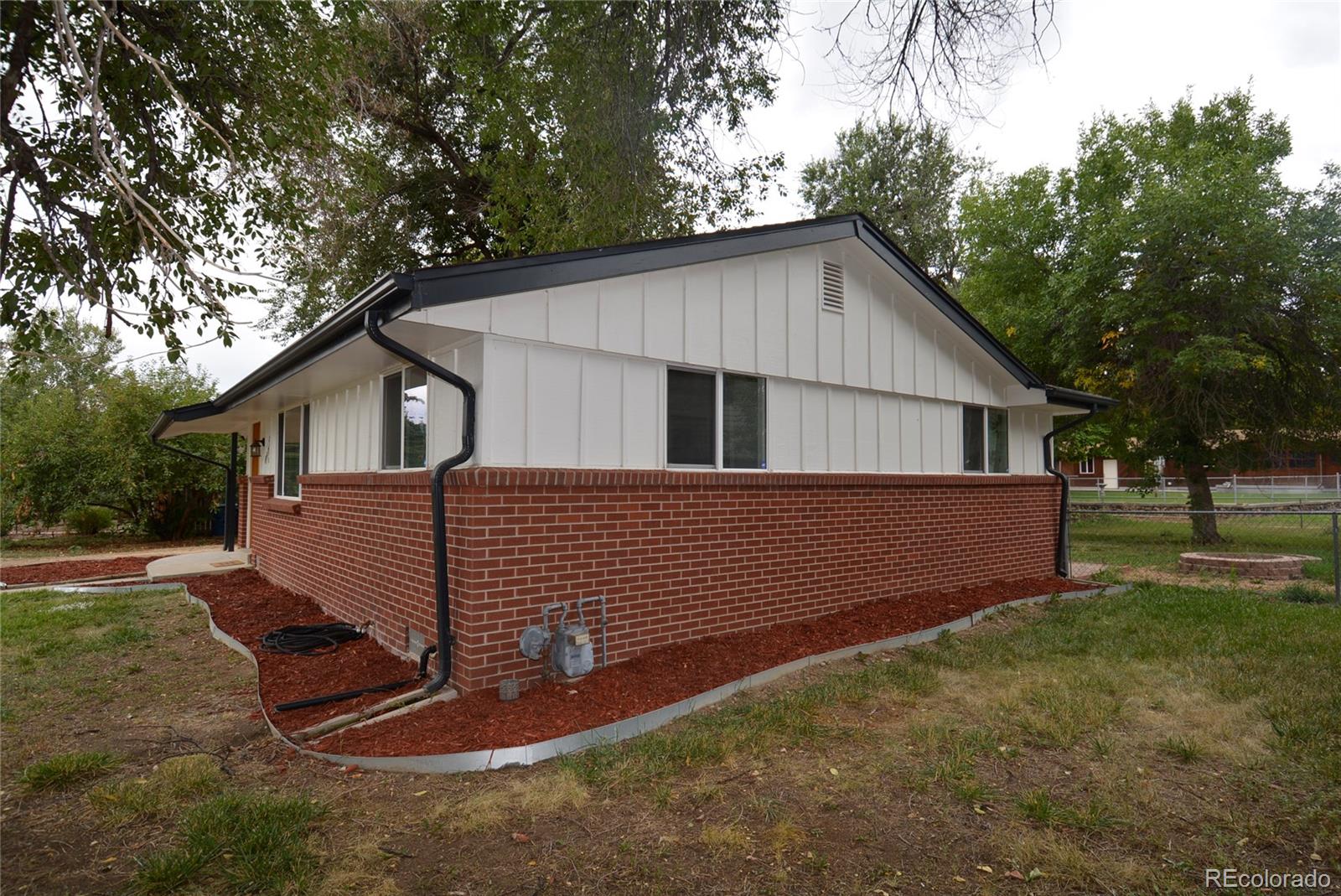 4975 Howell Street Golden, CO 80403 - Photo 5 of 23 a view of a house with a yard