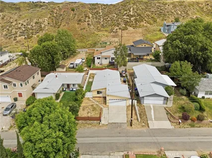 an aerial view of residential houses with outdoor space