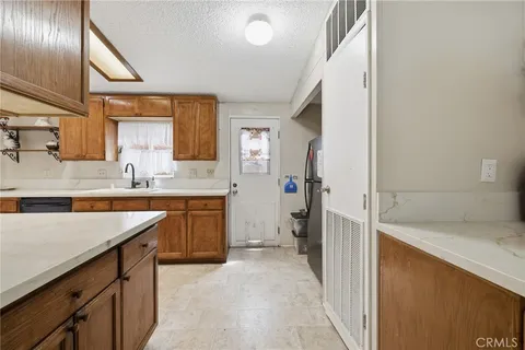 a bathroom with a sink a vanity and a large mirror