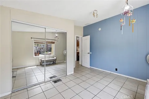 a living room with a table and a chair