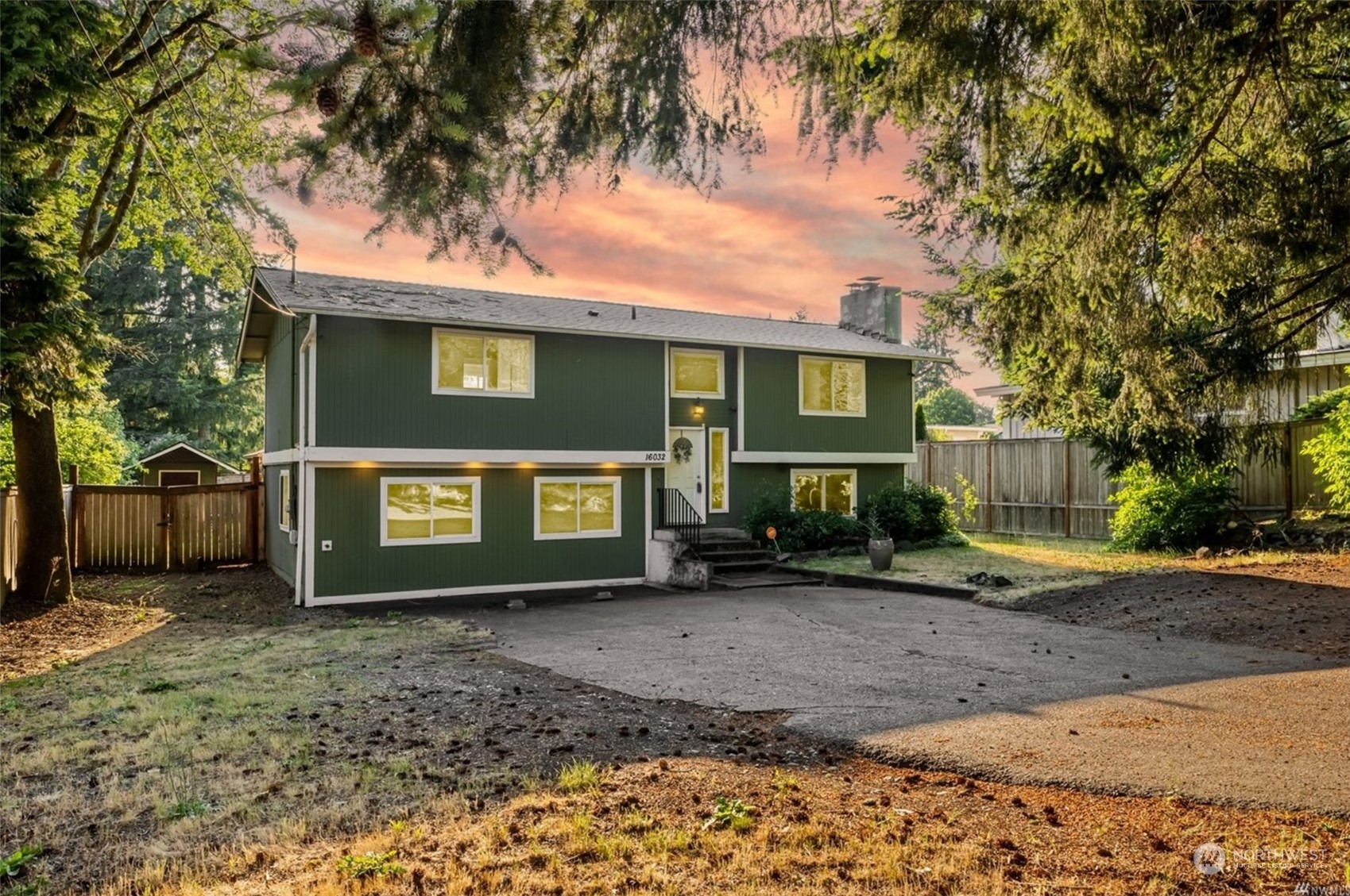16032 Spanaway Loop Road South Spanaway, WA 98387 - Photo 1 of 28 a front view of a house with a yard and garage