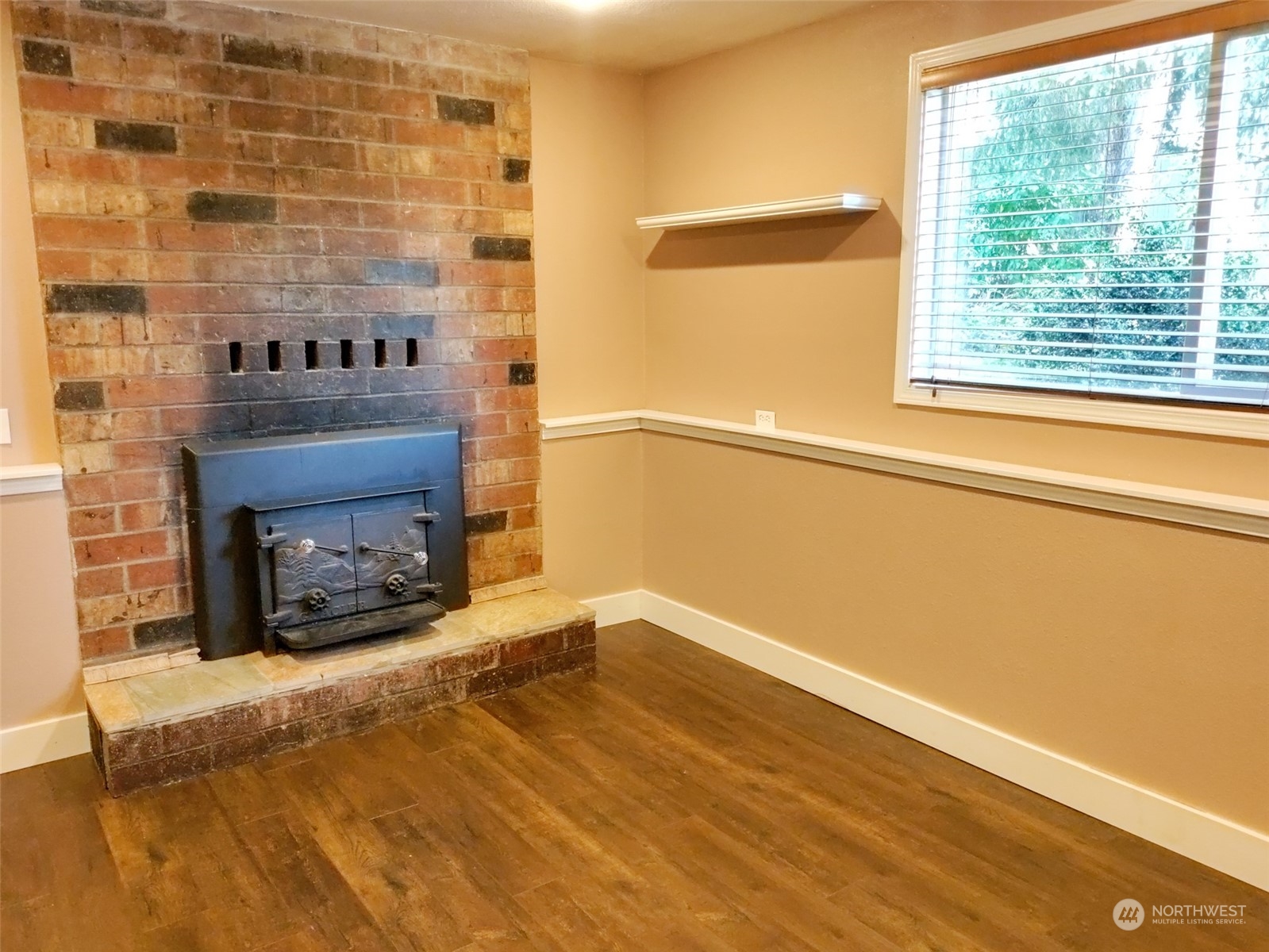 16032 Spanaway Loop Road South Spanaway, WA 98387 - Photo 12 of 28 a view of an empty room with a fireplace