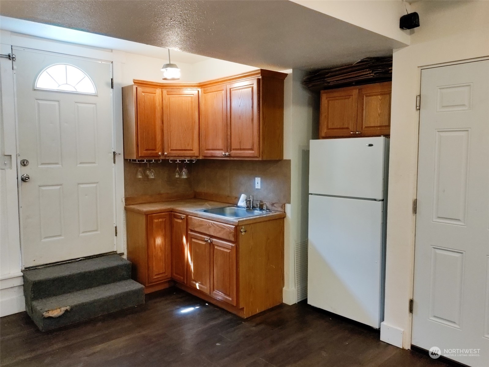 16032 Spanaway Loop Road South Spanaway, WA 98387 - Photo 14 of 28 a kitchen with granite countertop cabinets and refrigerator