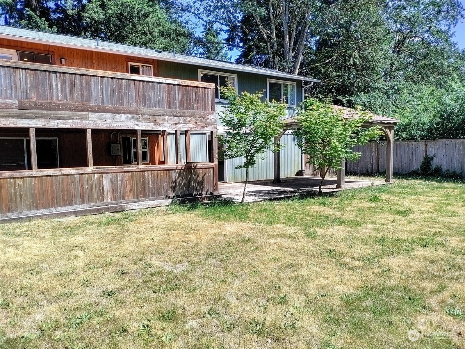 16032 Spanaway Loop Road South Spanaway, WA 98387 - Photo 19 of 28 a front view of a house with a yard