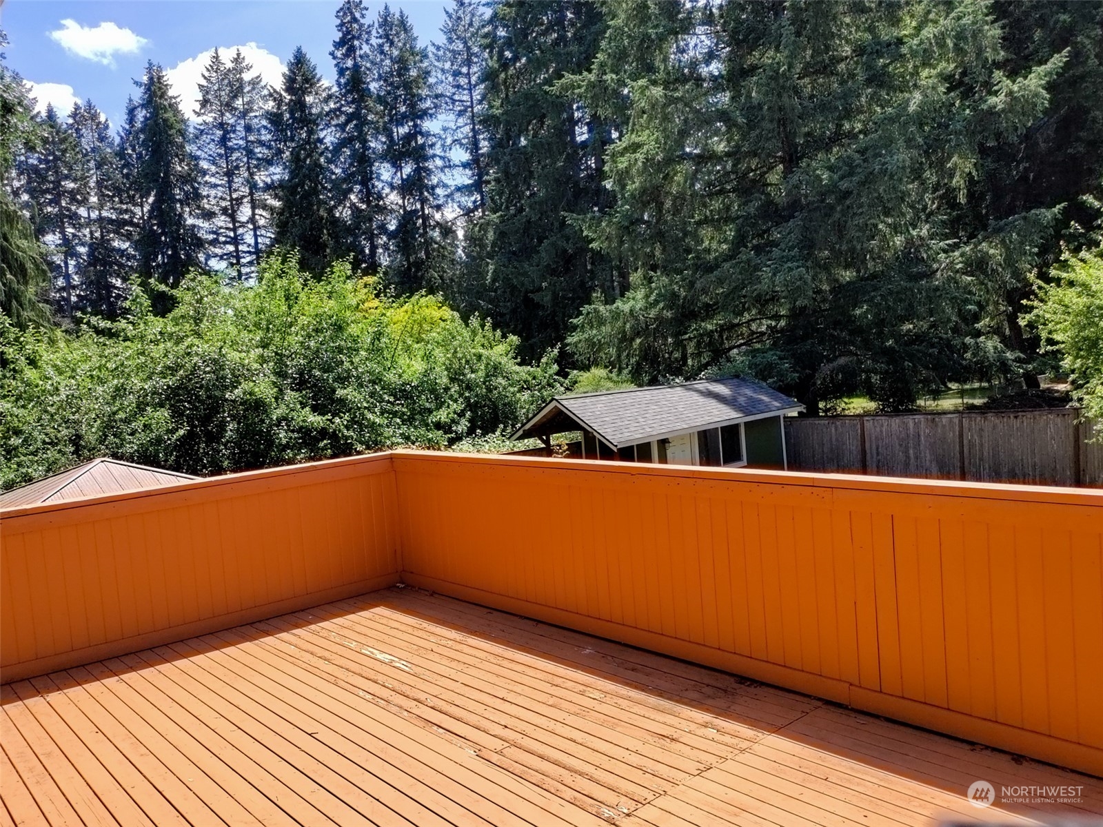 16032 Spanaway Loop Road South Spanaway, WA 98387 - Photo 24 of 28 a view of a room with wooden floor and a bench