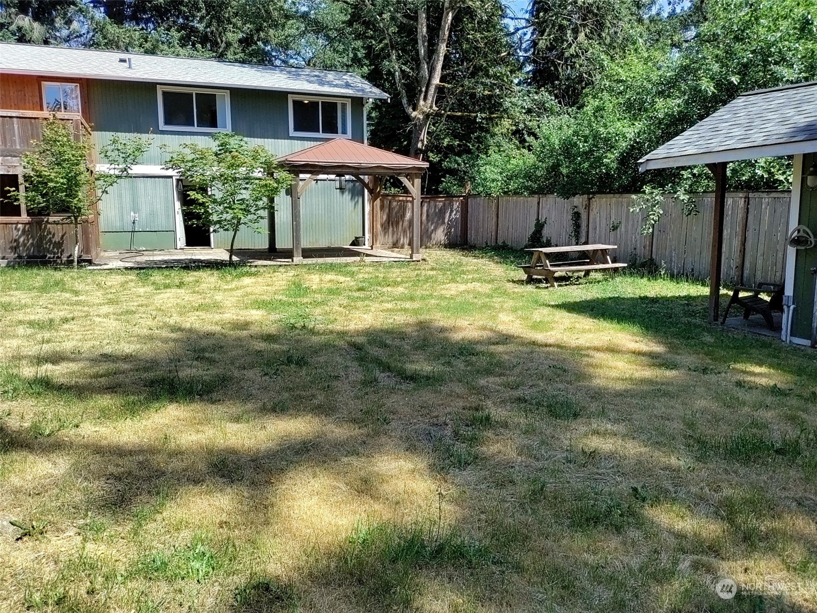 16032 Spanaway Loop Road South Spanaway, WA 98387 - Photo 27 of 28 a view of a house with backyard and sitting area