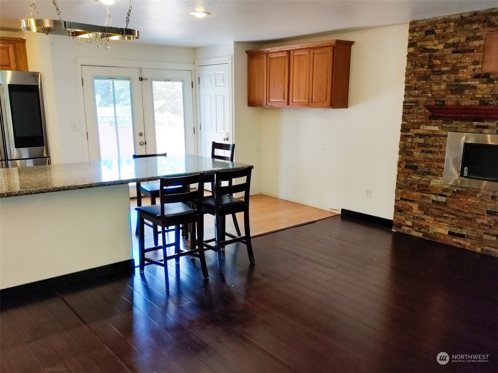 16032 Spanaway Loop Road South Spanaway, WA 98387 - Photo 5 of 28 a view of a dining room with furniture and wooden floor