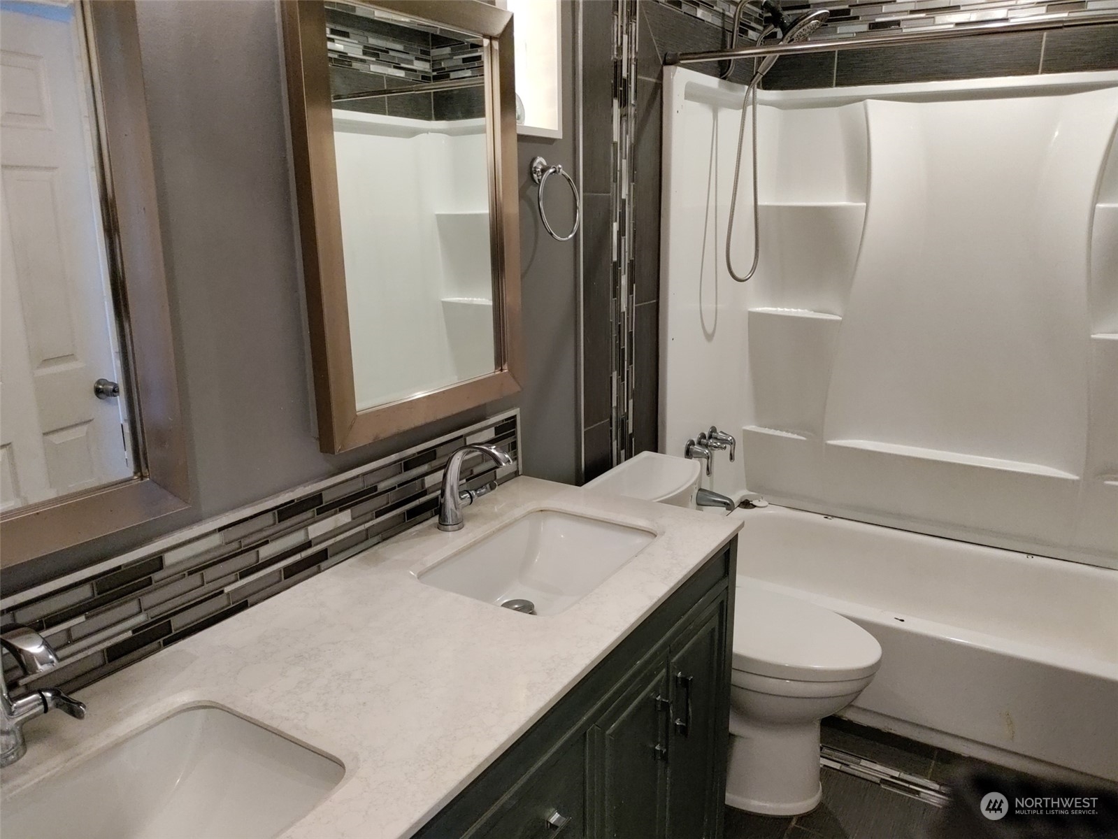 16032 Spanaway Loop Road South Spanaway, WA 98387 - Photo 9 of 28 a bathroom with a sink a toilet and shower