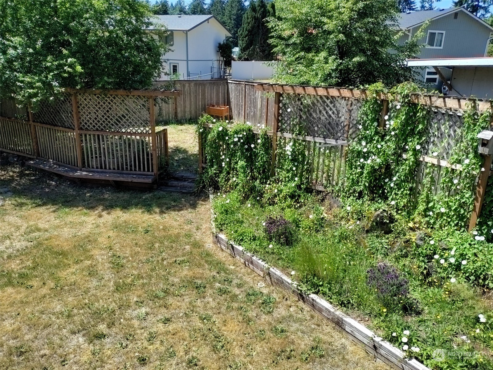 16032 Spanaway Loop Road South Spanaway, WA 98387 - Photo 10 of 28 a view of a garden with wooden fence