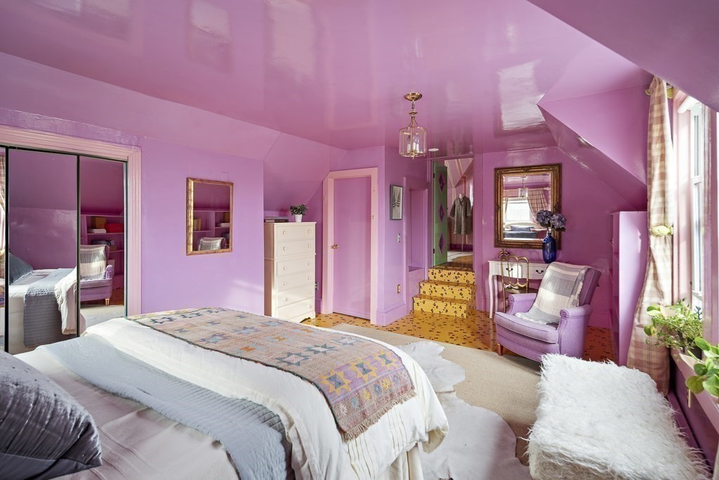 42 Spring Street Somerville, MA 02143 - Photo 17 of 23 a bedroom with a bed mirror and a chair