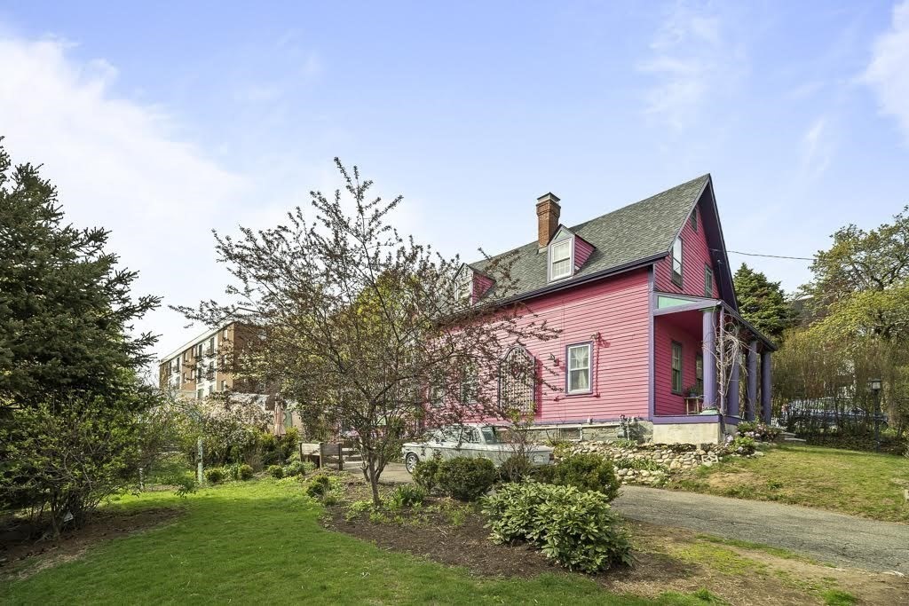 42 Spring Street Somerville, MA 02143 - Photo 2 of 23 a front view of a house with a yard