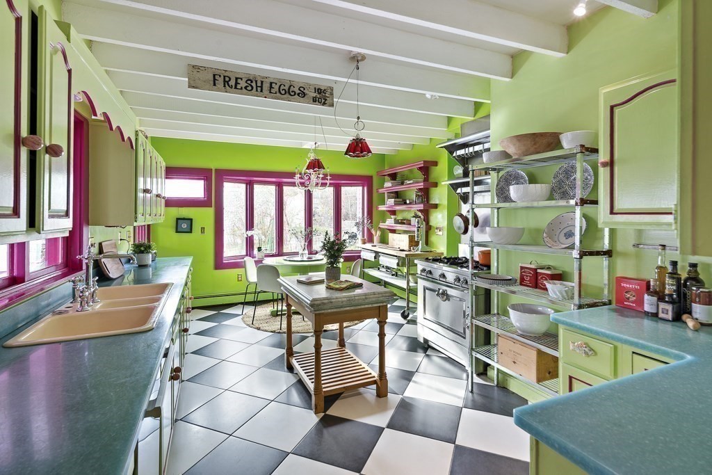 42 Spring Street Somerville, MA 02143 - Photo 10 of 23 a room with lots of wooden furniture and a potted plant