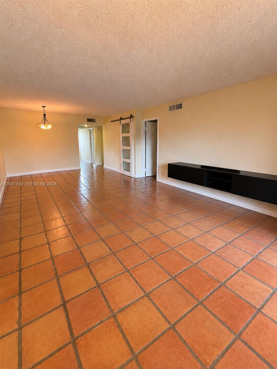 286 Racquet Club Road, Unit 204 Weston, FL 33326 - Photo 10 of 11 a view of a floor to ceiling window and an empty room