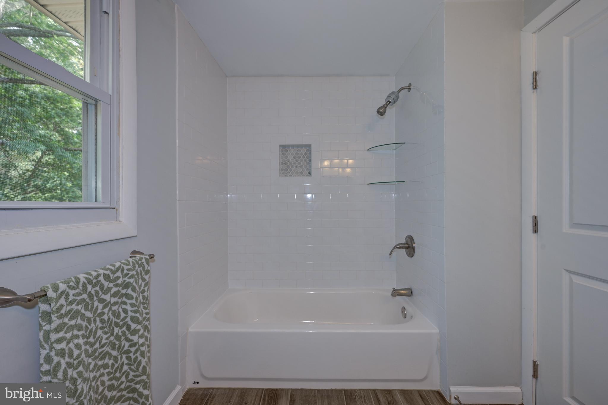 123 Clover Street Mount Holly, NJ 08060 - Photo 21 of 38 Modern bathroom with sleek tub and shower.