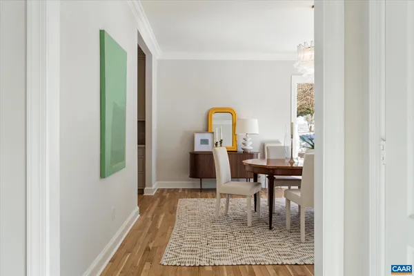 a dining room with furniture and a window