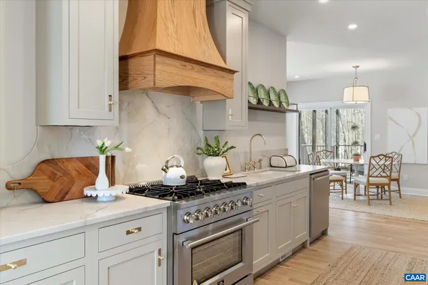 an empty room with wooden floor & door