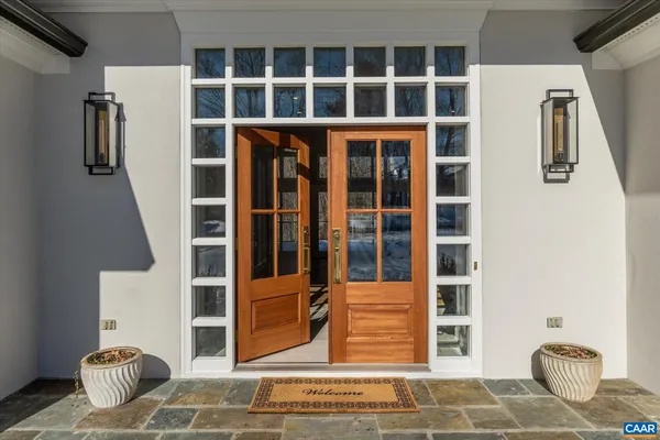 a kitchen with stainless steel appliances kitchen island granite countertop a sink a stove and cabinets