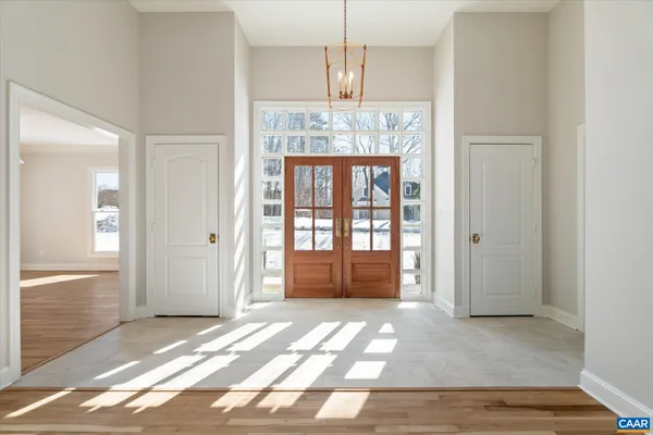 a kitchen with stainless steel appliances granite countertop a sink a stove and a wooden floors
