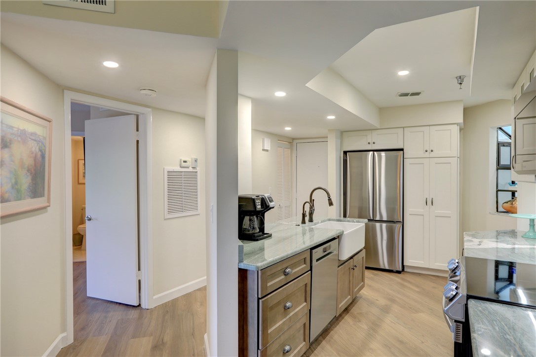 9612 Riverside Drive, Unit 102 Sebastian, FL 32958 - Photo 13 of 32 a bathroom with a double vanity sink mirror and shower
