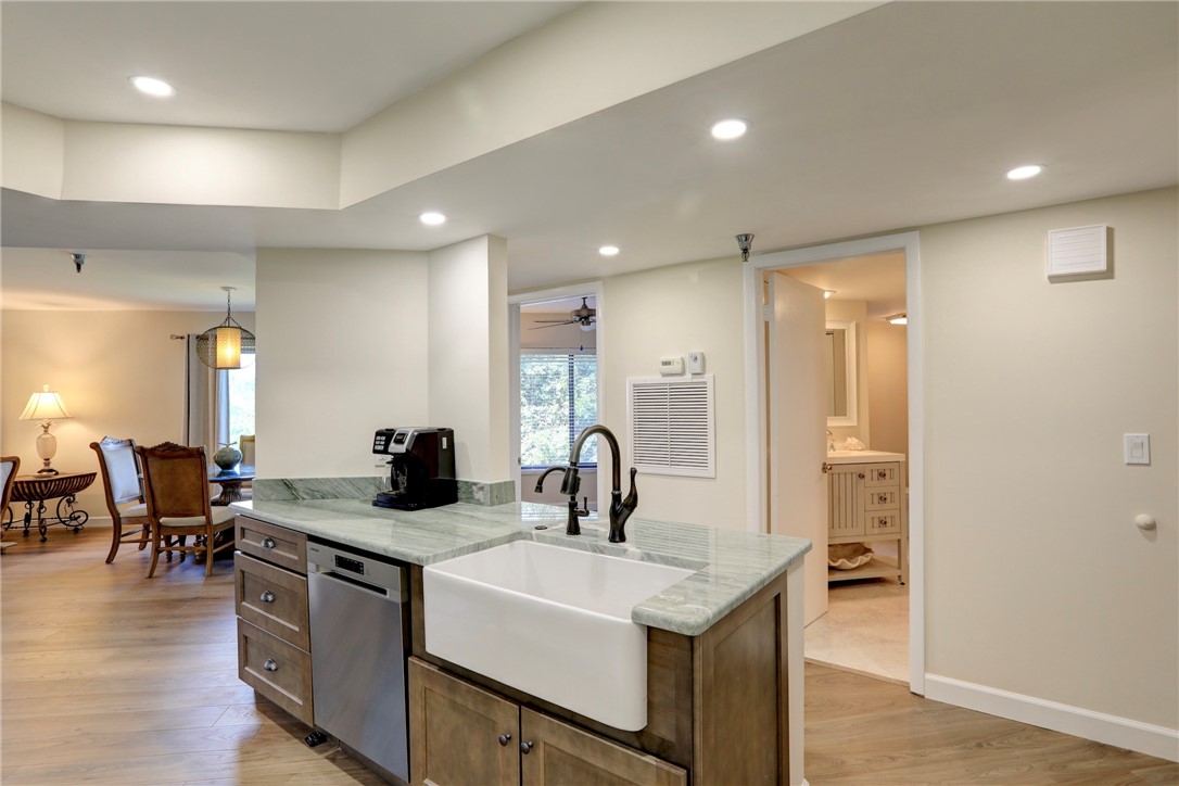 9612 Riverside Drive, Unit 102 Sebastian, FL 32958 - Photo 15 of 32 a kitchen with sink and refrigerator