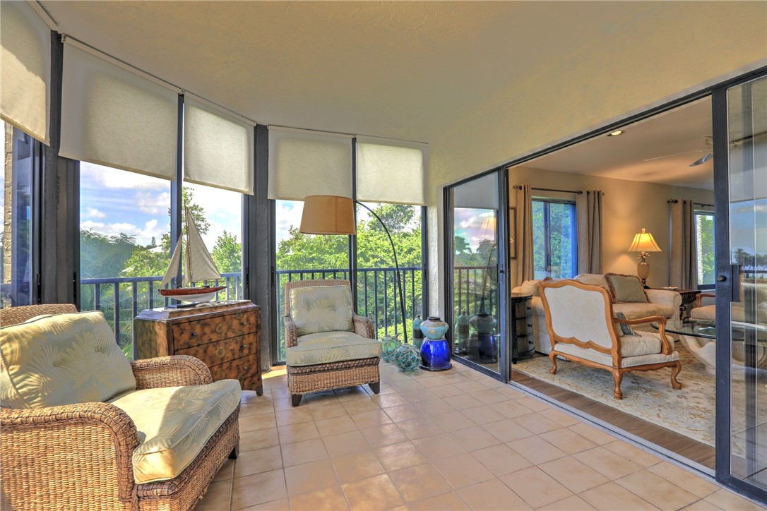 9612 Riverside Drive, Unit 102 Sebastian, FL 32958 - Photo 26 of 32 a living room with furniture and a large window