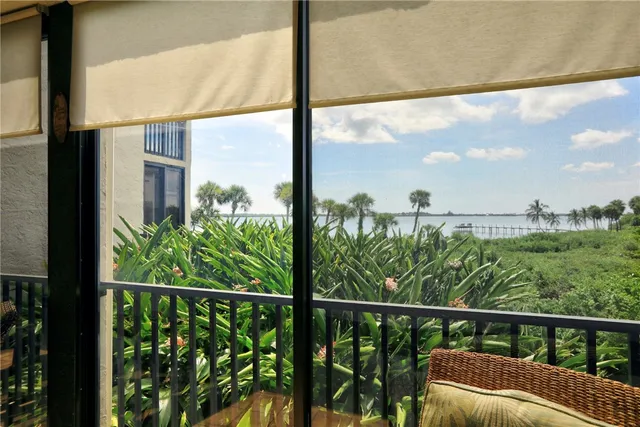 a view of a balcony with wooden floor