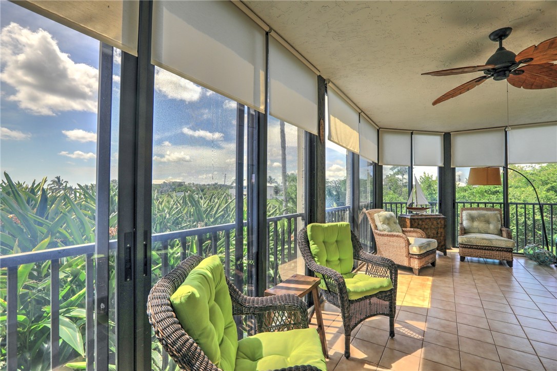 9612 Riverside Drive, Unit 102 Sebastian, FL 32958 - Photo 29 of 32 a living room with furniture and a large window