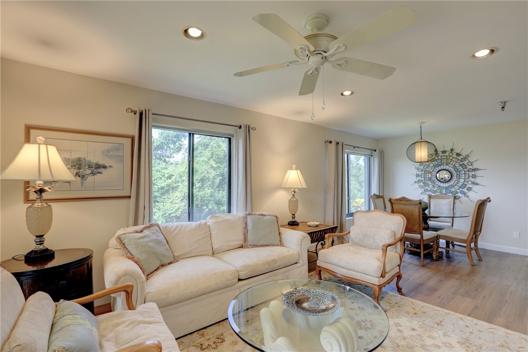 9612 Riverside Drive, Unit 102 Sebastian, FL 32958 - Photo 7 of 32 a living room with furniture and a large window