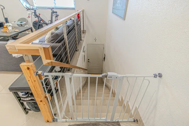 a view of a hallway with stairs