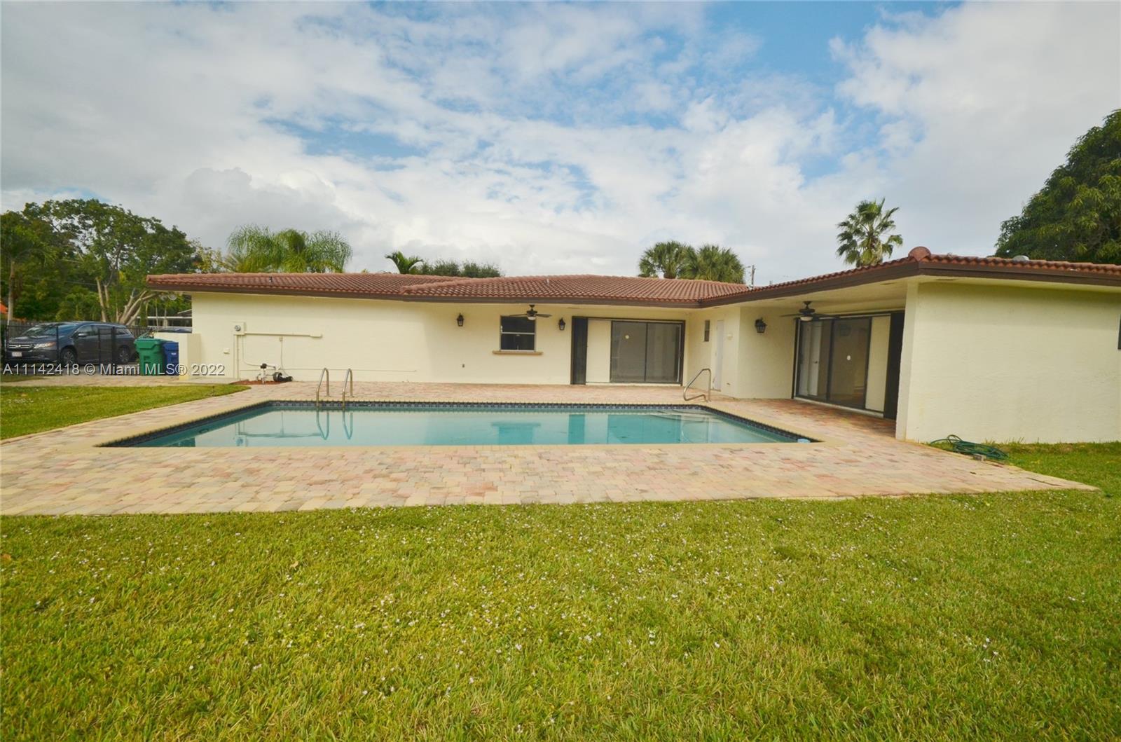 6760 Royal Melbourne Drive Hialeah, FL 33015 - Photo 16 of 36 a view of an house with backyard and garden