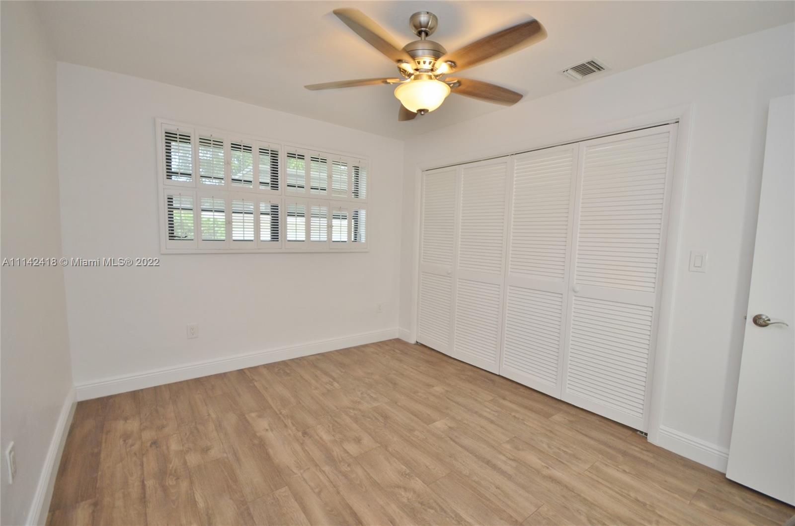 6760 Royal Melbourne Drive Hialeah, FL 33015 - Photo 28 of 36 a view of an empty room with a window