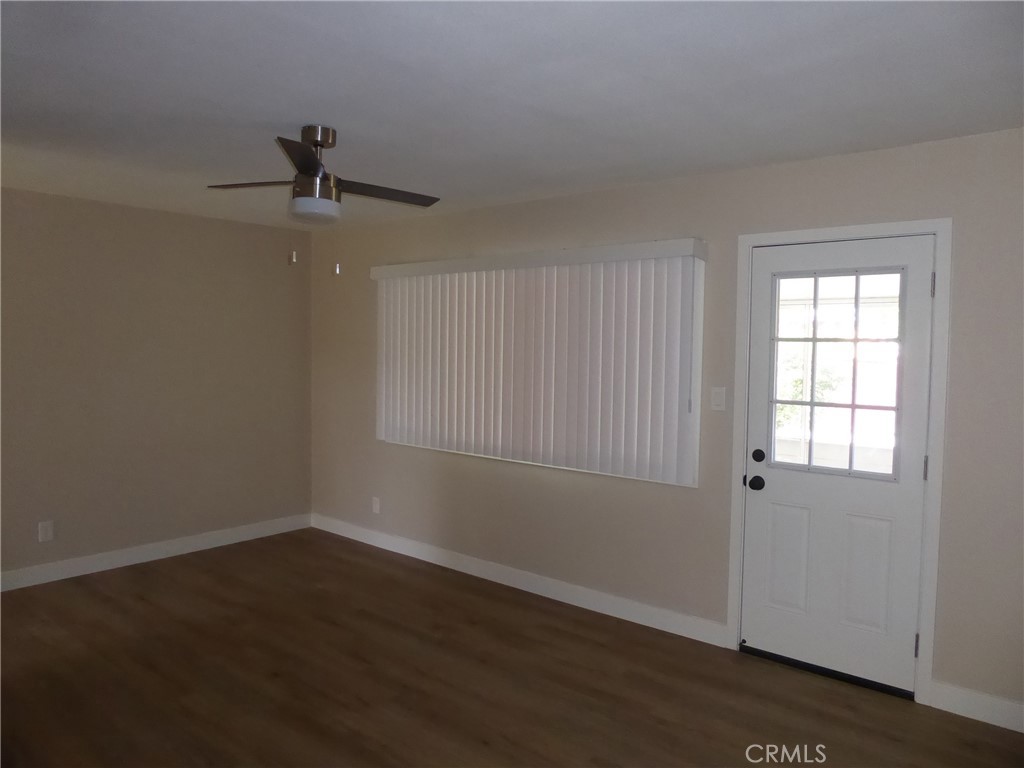 6641 Harley Street Riverside, CA 92506 - Photo 7 of 12 wooden floor in an empty room with a window