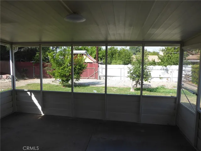 a view of house with backyard