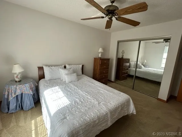 a bedroom with a bed and a walk in closet